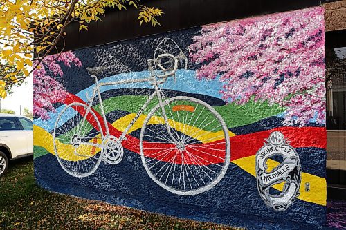 A piece of the Sekine bicycle mural on Westoba Credit Union in Rivers. Cherry blossoms and ribbons decorate the bicycle mural in an homage to Japanese and Indigenous culture. (Connor McDowell/The Brandon Sun)