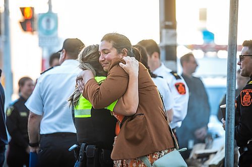 MIKAELA MACKENZIE / FREE PRESS

Christine Welsh (left, former police officer, current community safety team supervisor) hugs Angie Tuesday (family suport and resource advocate with the WPS), at the Winnipeg Police Service sacred fire lighting celebration on Monday, Sept. 29, 2025. 

For Tyler story.
Free Press 2025