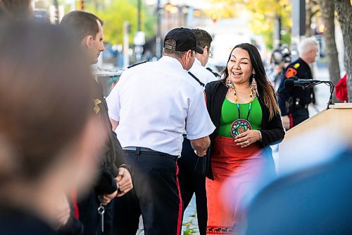 MIKAELA MACKENZIE / FREE PRESS

Winnipeg Police Service Indigenous relations advisor Sheila North shakes hands with chief Gene Bowers at the Winnipeg Police Service sacred fire lighting celebration on Monday, Sept. 29, 2025. 

For Tyler story.
Free Press 2025