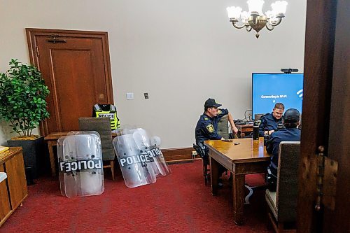 MIKE DEAL / FREE PRESS
Winnipeg Police Officers wait in a room in the basement of the Manitoba Legislative Building with riot gear piled in a corner just in case they are needed for a protest on the front steps of the building during the first day of the second session of the 43rd legislature, Wednesday afternoon.
Reporter: Maggie Macintosh
251001 - Wednesday, October 01, 2025.