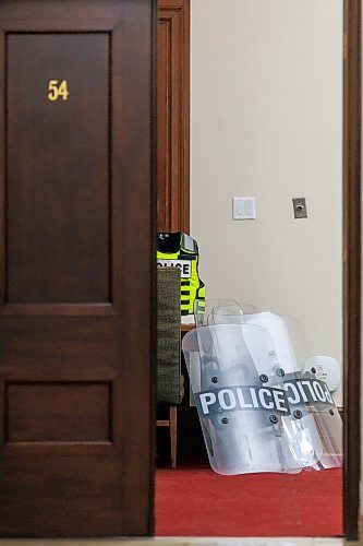 MIKE DEAL / FREE PRESS
Winnipeg Police Officers wait in a room in the basement of the Manitoba Legislative Building with riot gear piled in a corner just in case they are needed for a protest on the front steps of the building during the first day of the second session of the 43rd legislature, Wednesday afternoon.
Reporter: Maggie Macintosh
251001 - Wednesday, October 01, 2025.
