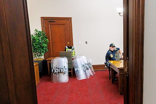 MIKE DEAL / FREE PRESS
Winnipeg Police Officers wait in a room in the basement of the Manitoba Legislative Building with riot gear piled in a corner just in case they are needed for a protest on the front steps of the building during the first day of the second session of the 43rd legislature, Wednesday afternoon.
Reporter: Maggie Macintosh
251001 - Wednesday, October 01, 2025.