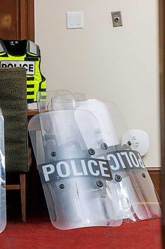 MIKE DEAL / FREE PRESS
Winnipeg Police Officers wait in a room in the basement of the Manitoba Legislative Building with riot gear piled in a corner just in case they are needed for a protest on the front steps of the building during the first day of the second session of the 43rd legislature, Wednesday afternoon.
Reporter: Maggie Macintosh
251001 - Wednesday, October 01, 2025.