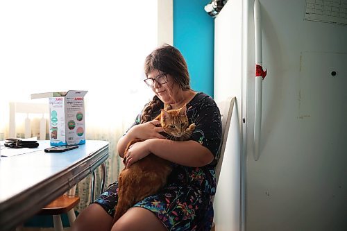02102025
Eighteen-year-old Zoey Cunningham visits with her cat Jack at the home she shares with her foster mom Pattie Cunningham in Souris on Thursday.
(Tim Smith/The Brandon Sun)