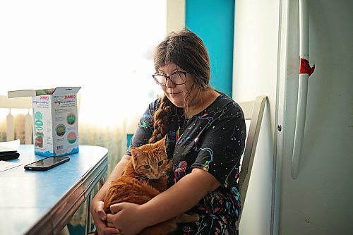 02102025
Eighteen-year-old Zoey Cunningham visits with her cat Jack at the home she shares with her foster mom Pattie Cunningham in Souris on Thursday.
(Tim Smith/The Brandon Sun)
