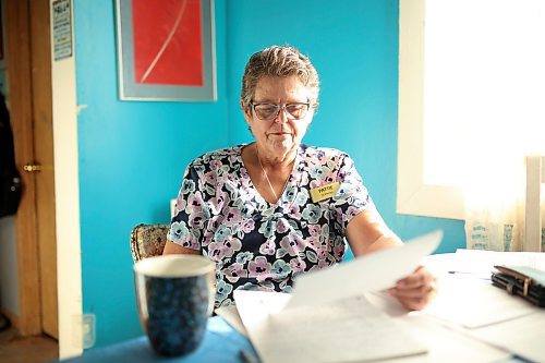 02102025
Pattie Cunningham looks over documents at the home she shares with her foster daughter Zoey Cunningham in Souris on Thursday.
(Tim Smith/The Brandon Sun)
