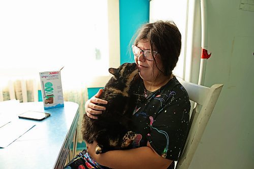 02102025
Eighteen-year-old Zoey Cunningham visits with her cat Lola at the home she shares with her foster mom Pattie Cunningham in Souris on Thursday.
(Tim Smith/The Brandon Sun)