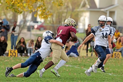 Crocus running back Muqtadir Apena (#1) is tackled while carrying the ball during fourth quarter action against the Grant Park. (Tim Smith/The Brandon Sun)