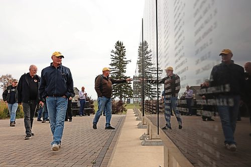 Participants in the conference at the air museum look over the memorial commemorating Canadians who died while serving in the Royal Canadian Air Force in the Second World War. (Tim Smith/The Brandon Sun)