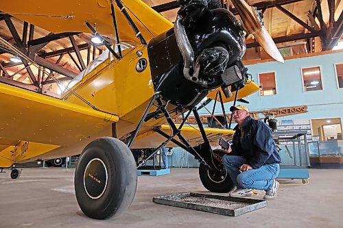 03102025
Cam Harrod of Dundas, Ontario looks over a Fleet Finch 1 while taking part in the Warbirds Canada Conference & Annual General Meeting at the Commonwealth Air Training Plan Museum on Friday.
(Tim Smith/The Brandon Sun)