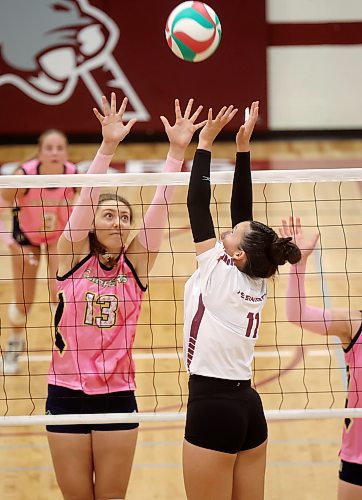 03102025
Tyra Lasuik #11 of the Assiniboine College Cougars leaps to set the ball during the Cougars exhibition match against Briercrest College at AC on Friday evening.
(Tim Smith/The Brandon Sun)