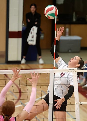 03102025
Kylee Peake #4 of the Assiniboine College Cougars leaps to put the ball over the net during an exhibition match against Briercrest College at AC on Friday evening.
(Tim Smith/The Brandon Sun)