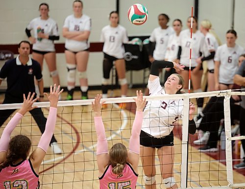 03102025
Payton McNish #9 of the Assiniboine College Cougars leaps to put the ball over the net during the Cougars exhibition match against Briercrest College at AC on Friday evening. 
(Tim Smith/The Brandon Sun)