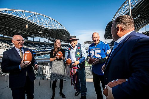 MIKAELA MACKENZIE / FREE PRESS

Mayor Scott Gillingham (left), minister of education Tracy Schmidt, MMF minister of youth and sport Richard Genaille, Travel Manitoba president and CEO Colin Ferguson, and Winnipeg Football Club president and CEO Wade Miller at a Grey Cup festival announcement at Princess Auto Stadium on Monday, Oct. 6, 2025. 

For sports story.
Free Press 2025