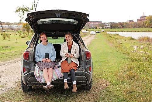 06102025
Friends Bethany Penner and Lauren Doerksen laugh while enjoying lunch together at Dinsdale Park in Brandon on a cloudy Monday. 
(Tim Smith/The Brandon Sun)