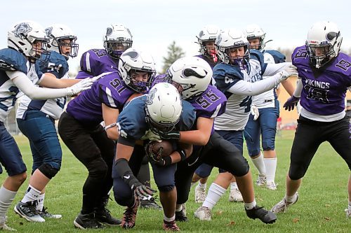 Massey's Oakley Peters, left, and Lance Burton team up to tackle Grant Parks' Orlando Brown. (Thomas Friesen/The Brandon Sun)