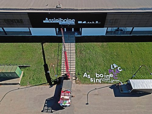 07102025
A worker with Off The Wall Signs installs the new lettering for Assiniboine Credit Union Place on the west side of the arena on Tuesday. 
(Tim Smith/The Brandon Sun)
default