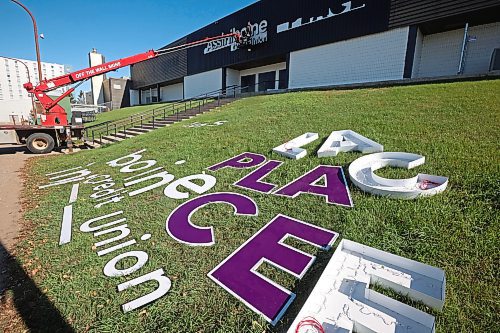 07102025
A worker with Off The Wall Signs installs the new lettering for Assiniboine Credit Union Place on the west side of the arena on Tuesday. 
(Tim Smith/The Brandon Sun)