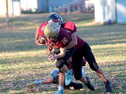 Crocus Plainsmen Kayven Brown (16) gets taken down down by Sturgeon Heights' Taylor Knox (53) during JV Winnipeg High School Football League action at Crocus on Wednesday. (Massimo De Luca-Taronno/The Brandon Sun)