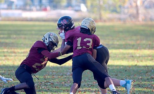 Jasim Ameh (#13) and Daniel Emenogu (#28) team up for a Crocus tackle in the second half of play. (Massimo De Luca-Taronno/The Brandon Sun)