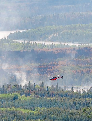 MIKE DEAL / FREE PRESS
Tour of the wildfire conditions around Flin Flon by helicopter.
Premier Wab Kinew takes a tour of the wildfires in northern Manitoba, making stops in Flin Flon and Thompson.
250612 - Thursday, June 12, 2025.