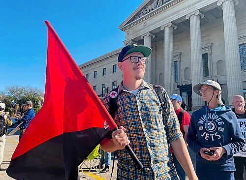 Ruth Bonneville / Free Press 
LOCAL - postal workers
Mail carrier with Canada Post, Matthew Aitken with a group of postal workers and Allies rallying at the Manitoba Legislature Thursday. 
See story by Carol. 
Oct 09, 2025