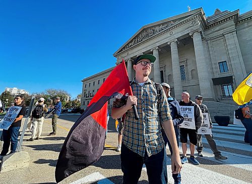 Ruth Bonneville / Free Press 
LOCAL - postal workers
Mail carrier with Canada Post, Matthew Aitken with a group of postal workers and Allies rallying at the Manitoba Legislature Thursday. 
See story by Carol. 
Oct 09, 2025