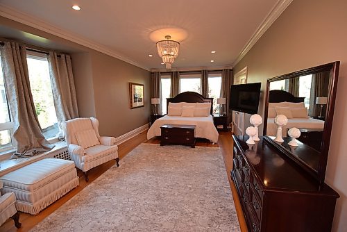 Todd Lewys / Free Press
The primary bedroom is a warm, inviting retreat filled with natural light and featuring a deluxe walk-in closet with custom slat wall storage.