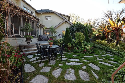 Todd Lewys / Free Press
Paradise awaits at the back of the home with a backyard with outdoor kitchen, patio, eating area, gorgeous landscaping and an attached backyard featuring a water fountain and gazebo.