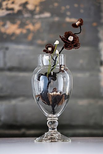 Ruth Bonneville / Free Press
49.8 - Creators
Photo of flower arrangement made with twisted hair and baby teeth.
Local artist, Sandra Klowak with Corporeal Curios, who creates artwork from hair, in her studio with samples of her work.
Story: Sandra Klowak creates artwork from hair for clients who donate hair of their loved ones who have died. It’s a form of sculpture which originated in the Victorian era.
Klowak has recently begun incorporating teeth – donated from friends and family members – into her personal artwork.
Oct 15, 2025