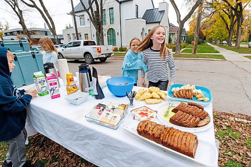 MIKE DEAL / FREE PRESS
Annie MacDonald and her friend Ruby Kurz react after serving a large number of teachers from their school who came by for morning coffee&#x2019;s before the start of the school day.
Every Thursday morning since the beginning of September Jennie MacDonald&#x2019;s nine-year-old daughter Annie has been setting up a coffee stand on the corner of their street to raise money for CancerCare Manitoba.
Reporter: Eva Wasney
251016 - Thursday, October 16, 2025.
