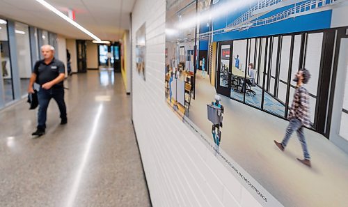 MIKE DEAL / FREE PRESS
A person walks down the hallway outside of the CAMTT Collaborative Workspace past a architectural rendering on the wall showing the same hallway and the CAMTT Collaborative Workspace.
Fred Meier, President and CEO, RRC Polytech and Dr. Vikram Banthia, Director, Price Institute of Advanced Manufacturing and Mechatronics, RRC Polytech during the unveiling of the new Centre for Automation and Manufacturing Technology Transfer (CAMTT Collaborative Workspace). The large workspace is within the Price Institute of Advanced Manufacturing and Mechanics at the RRC Polytech Notre Dame Campus.
Reporter:
251016 - Thursday, October 16, 2025.