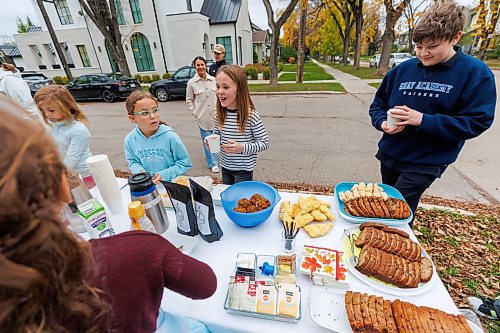 MIKE DEAL / FREE PRESS
Annie MacDonald (stripped shirt) prepares a drink for a customer at the corner of Waterloo Street and Kingsway.
Every Thursday morning since the beginning of September Jennie MacDonald&#x2019;s nine-year-old daughter Annie has been setting up a coffee stand on the corner of their street to raise money for CancerCare Manitoba.
Reporter: Eva Wasney
251016 - Thursday, October 16, 2025.