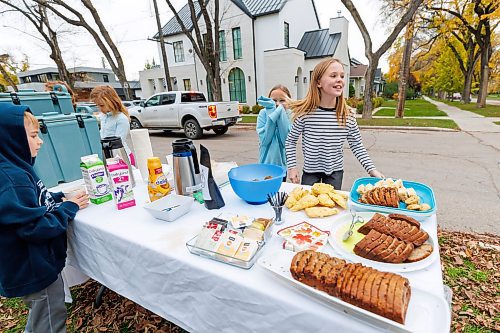 MIKE DEAL / FREE PRESS
Annie MacDonald and her friend Ruby Kurz react after serving a large number of teachers from their school who came by for morning coffee&#x2019;s before the start of the school day.
Every Thursday morning since the beginning of September Jennie MacDonald&#x2019;s nine-year-old daughter Annie has been setting up a coffee stand on the corner of their street to raise money for CancerCare Manitoba.
Reporter: Eva Wasney
251016 - Thursday, October 16, 2025.