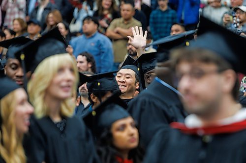 MIKE DEAL / FREE PRESS
Jianbo Wang waves to family and friends before receiving a Master’s in Management degree.
Graduates along with friends and family attend the University of Winnipeg’s 127th fall Convocation at Duckworth Centre Friday morning.
Along with celebrating the work of students, staff and faculty the University bestowed an honourary doctorate on Scott Oake.
Standup
251017 - Friday, October 17, 2025.