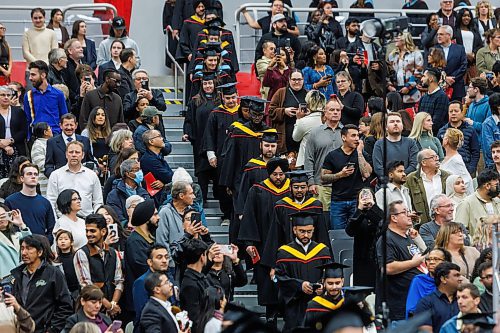 MIKE DEAL / FREE PRESS
Students enter the building, filing past family and friends on their way to becoming graduates.
Graduates along with friends and family attend the University of Winnipeg’s 127th fall Convocation at Duckworth Centre Friday morning.
Along with celebrating the work of students, staff and faculty the University bestowed an honourary doctorate on Scott Oake.
Standup
251017 - Friday, October 17, 2025.