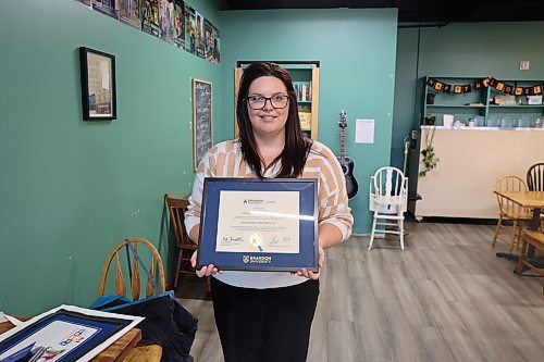 Earl Oxford School music teacher Erin Dodds with her Brandon University’s 'Outstanding Young Alumni Award' Monday afternoon. The award is presented annually by the BU Alumni Association to graduates aged 35 or younger who demonstrate leadership, dedication, and positive impact in their professions or communities. (Abiola Odutola/The Brandon Sun)
