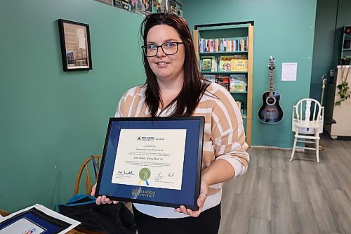 Earl Oxford School music teacher Erin Dodds with her Brandon University’s 'Outstanding Young Alumni Award' Monday afternoon. The award is presented annually by the BU Alumni Association to graduates aged 35 or younger who demonstrate leadership, dedication, and positive impact in their professions or communities. (Abiola Odutola/The Brandon Sun)