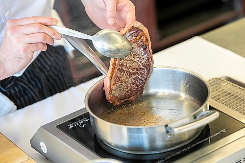 MIKAELA MACKENZIE / FREE PRESS
	
Jordan Carlson demonstrates how to cook a steak at RRC Polytech on Tuesday, May 13, 2025. 
For Eva story.
Winnipeg Free Press 2025