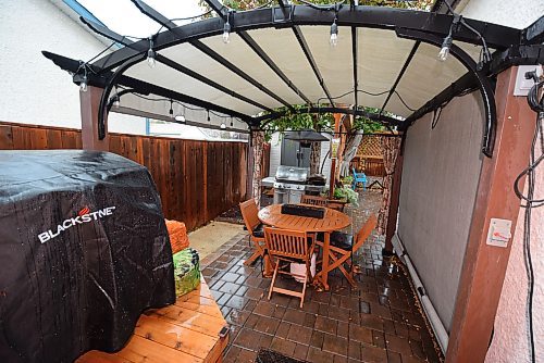 Todd Lewys / Free Press
The fabulous backyard starts off with a pergola area and patio and branches out into another patio plus a firepit, cat run and shed.  