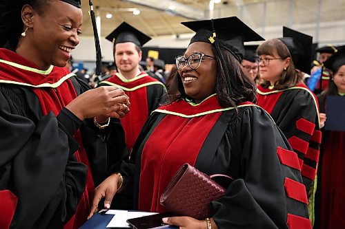 Ruth Bonneville / Free Press
Local standup - UM Fall Convocation 2025
Tosin Elizabeth Omole (right) prepares to receive her Doctor of Philosophy as she shares some laughs with her fellow graduate, Malu Diane Tshikudi (left), also receiving her Doctor of Philosophy, prior to their graduation ceremony at the Fort Garry Campus Tuesday.
Oct 21, 2025