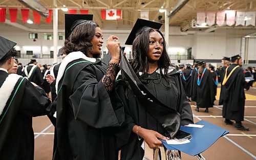 Ruth Bonneville / Free Press
Local standup - UM Fall Convocation 2025
Precious Ugbo (left) and Ayomide Orogun finish dressing up in their cap and gown just prior receiving their Batchelor of Nursing degree at their graduation ceremony at the Fort Garry Campus Tuesday.
Oct 21, 2025