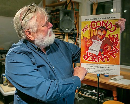 BROOK JONES/FREE PRESS
The Audi Arts Festival and The Old Elmwood Radio Theatre will be presenting The Condo Down Under at The Gargoyle Theatre at 585 Elice Ave. on Saturday, Oct. 25. Writer Stephen Gillies, 72, is pictured holding a promotional poster during a rehearsal at his home studio in Winnipeg, Man., Tuesday, Oct. 21, 2025.