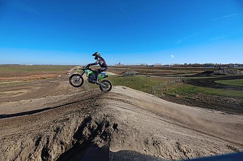 Sixty-five-year-old Scott Harland of Brandon takes a small jump over one of the hills of a dirt bike track along the Trans-Canada Highway west of Grand Valley on a warm and sunny Thursday afternoon. Harland, who was out on the course with fellow Brandon dirt bike enthusiast Dave Mahoney, has been racing dirt bikes since he was a teenager and still engages in race events now. (Matt Goerzen/The Brandon Sun)