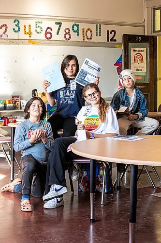 MIKAELA MACKENZIE / FREE PRESS
Earl Grey Press reporters Sebastian (11, left), Isabel (11), Willow (12), and James (10) at Earl Grey School on Thursday, Oct. 23, 2025. 
For Melissa story.
Free Press 2025