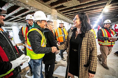 MIKAELA MACKENZIE / FREE PRESS
Rebeccaʃhartrand, minister of northern affairs, shakes hands with PCL workers at the under-construction Wehwehneh Bahgahkinahgohnʢuilding on Friday, Oct. 24, 2025. 
For Tyler/feature story.
Free Press 2025