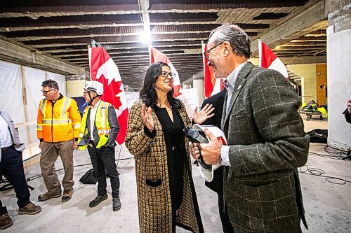 MIKAELA MACKENZIE / FREE PRESS
Rebeccaʃhartrand, minister of northern affairs (left), chats with Jim Ludlow, president of True North Real Estate Development, at the under-construction Wehwehneh Bahgahkinahgohnʢuilding on Friday, Oct. 24, 2025. 
For Tyler/feature story.
Free Press 2025