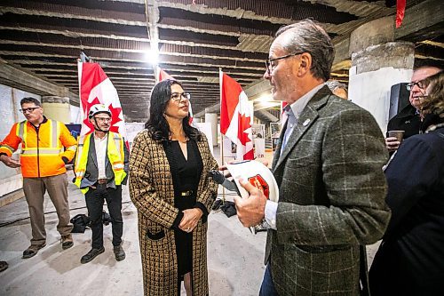 MIKAELA MACKENZIE / FREE PRESS
Rebeccaʃhartrand, minister of northern affairs (left), chats with Jim Ludlow, president of True North Real Estate Development, at the under-construction Wehwehneh Bahgahkinahgohnʢuilding on Friday, Oct. 24, 2025. 
For Tyler/feature story.
Free Press 2025