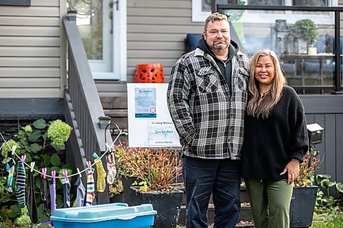 MIKAELA MACKENZIE / FREE PRESS

Jason Chester and Mylene Layno with their Socktober display in the front yard on Wednesday, Oct. 22, 2025. The husband-and-wife duo do a sock drive to collect socks for Main Street Project&#039;s Socktober campaign every year in honour of their late son, Justice Chester, who died in 2021 as a result of an intentional drug overdose.

For Aaron story.
Free Press 2025
