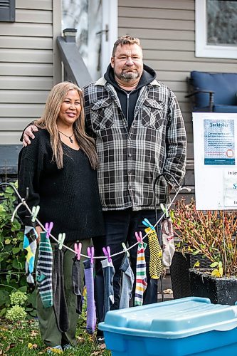 MIKAELA MACKENZIE / FREE PRESS
Jason Chester and Mylene Layno with their Socktober display in the front yard on Wednesday, Oct. 22, 2025. The husband-and-wife duo do a sock drive to collect socks for Main Street Project's Socktober campaign every year in honour of their late son, Justice Chester, who died in 2021 as a result of an intentional drug overdose.
For Aaron story.
Free Press 2025